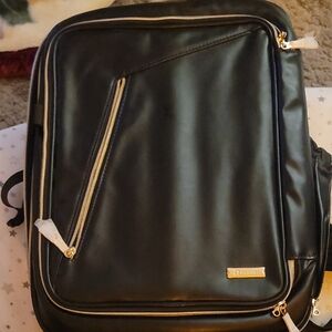 This is a professional black FA leather makeup artist backpack with gold